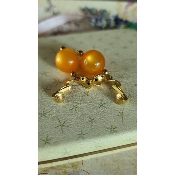 Celebrity Orange Dangling Clip-on Earrings - Picture 9 of 10